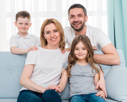 Happy Family Sitting Together After Home Purchase in Colorado